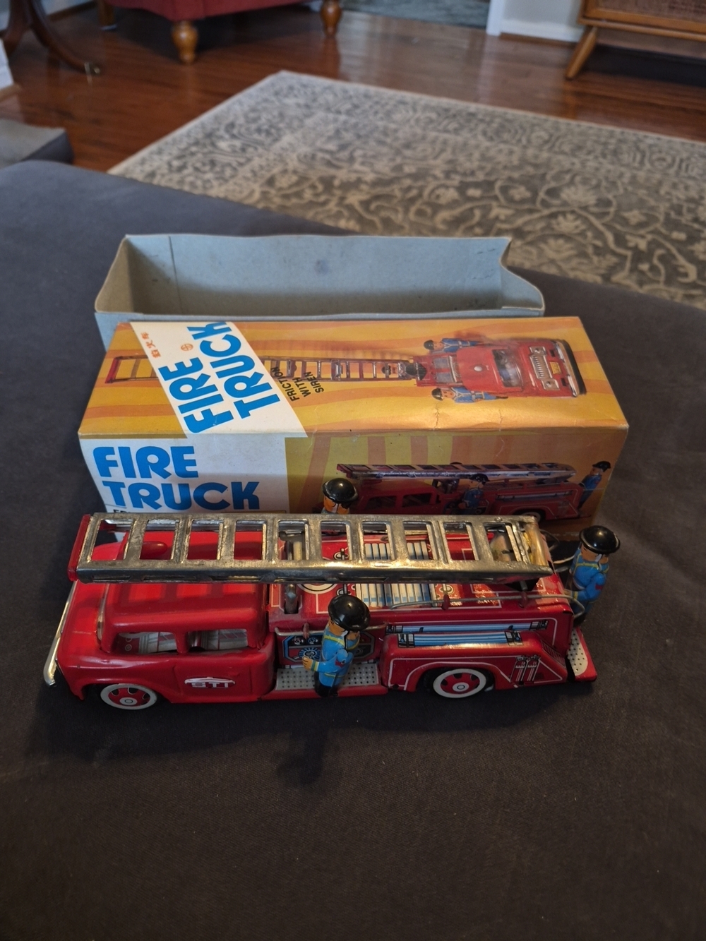 Source Unknown Red Fire Truck Toy with Silver Ladder and Blue Firefighters